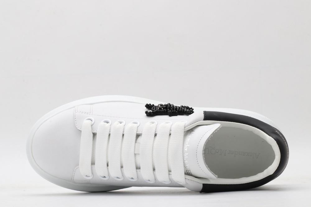 AMQ white oversized sneakers with black heel