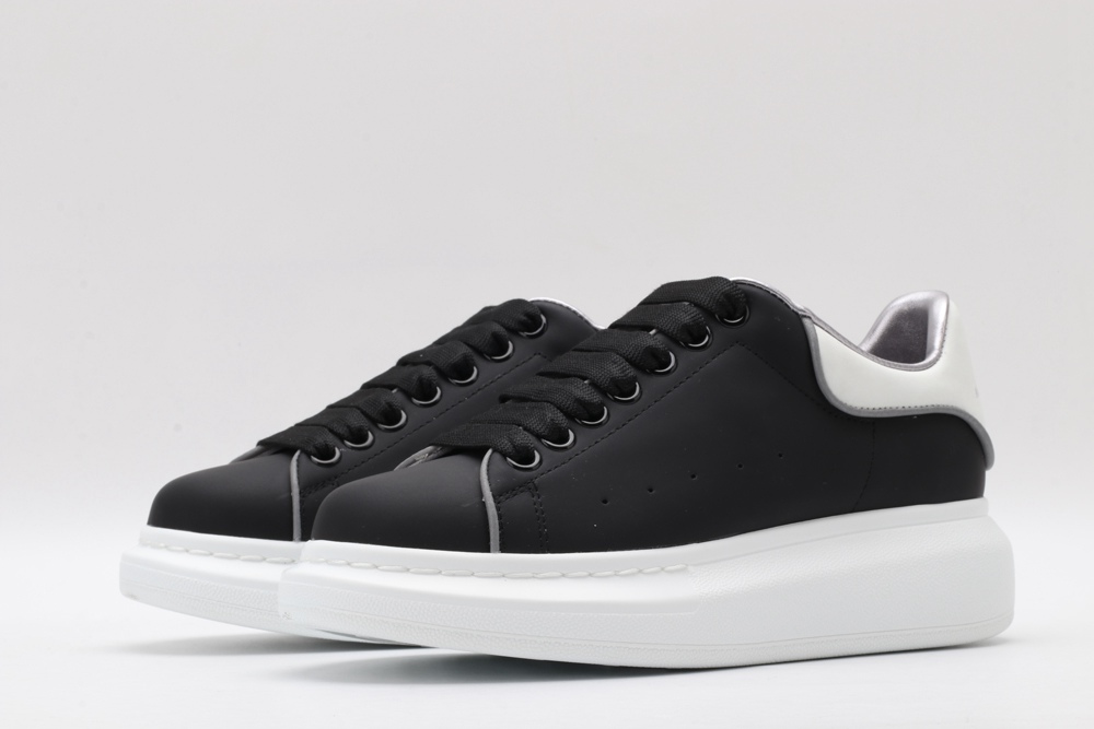AMQ oversized black sneakers with white heel
