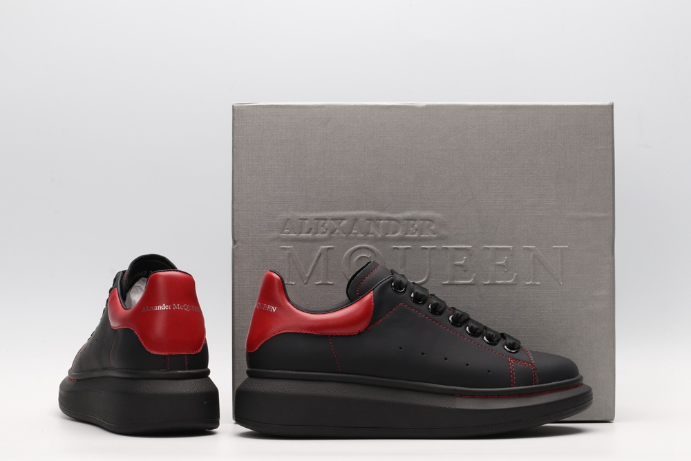 AMQ black oversized sneakers with red heel