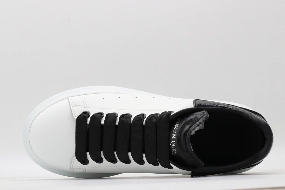 AMQ OVERSIZED SNEAKER with blue stamped python heel
