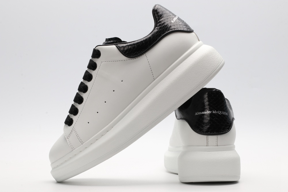 AMQ OVERSIZED SNEAKER with blue stamped python heel