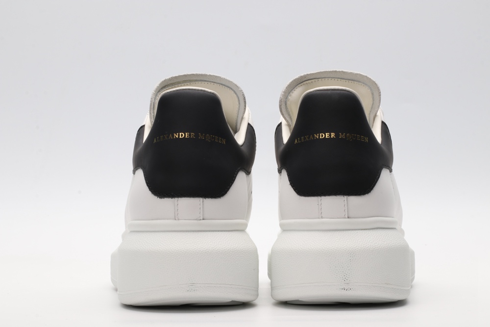 AMQ white oversized sneakers with black heel